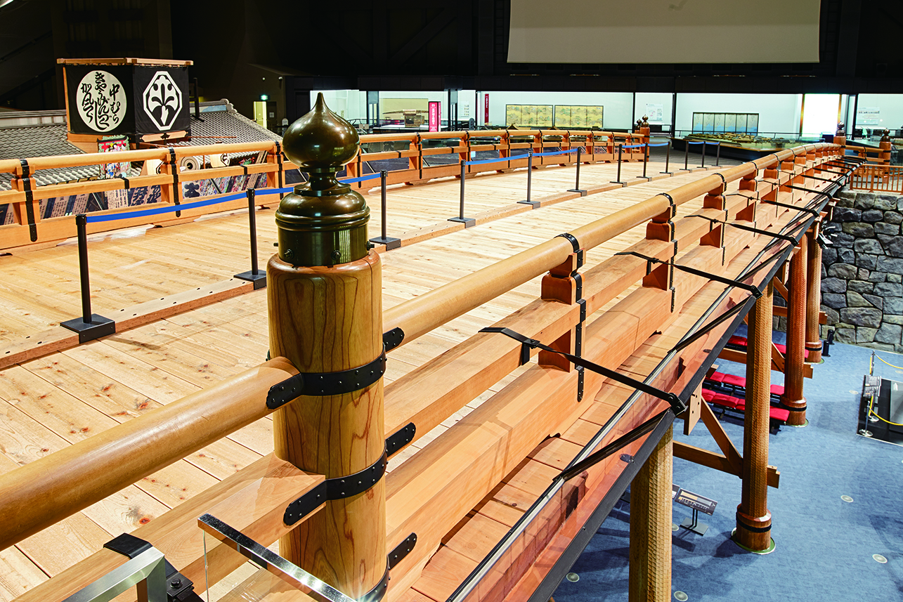 The replica bridge from the Edo-Tokyo museum, seen from the side with a simulated "river" beneath it on the visitor floor below.