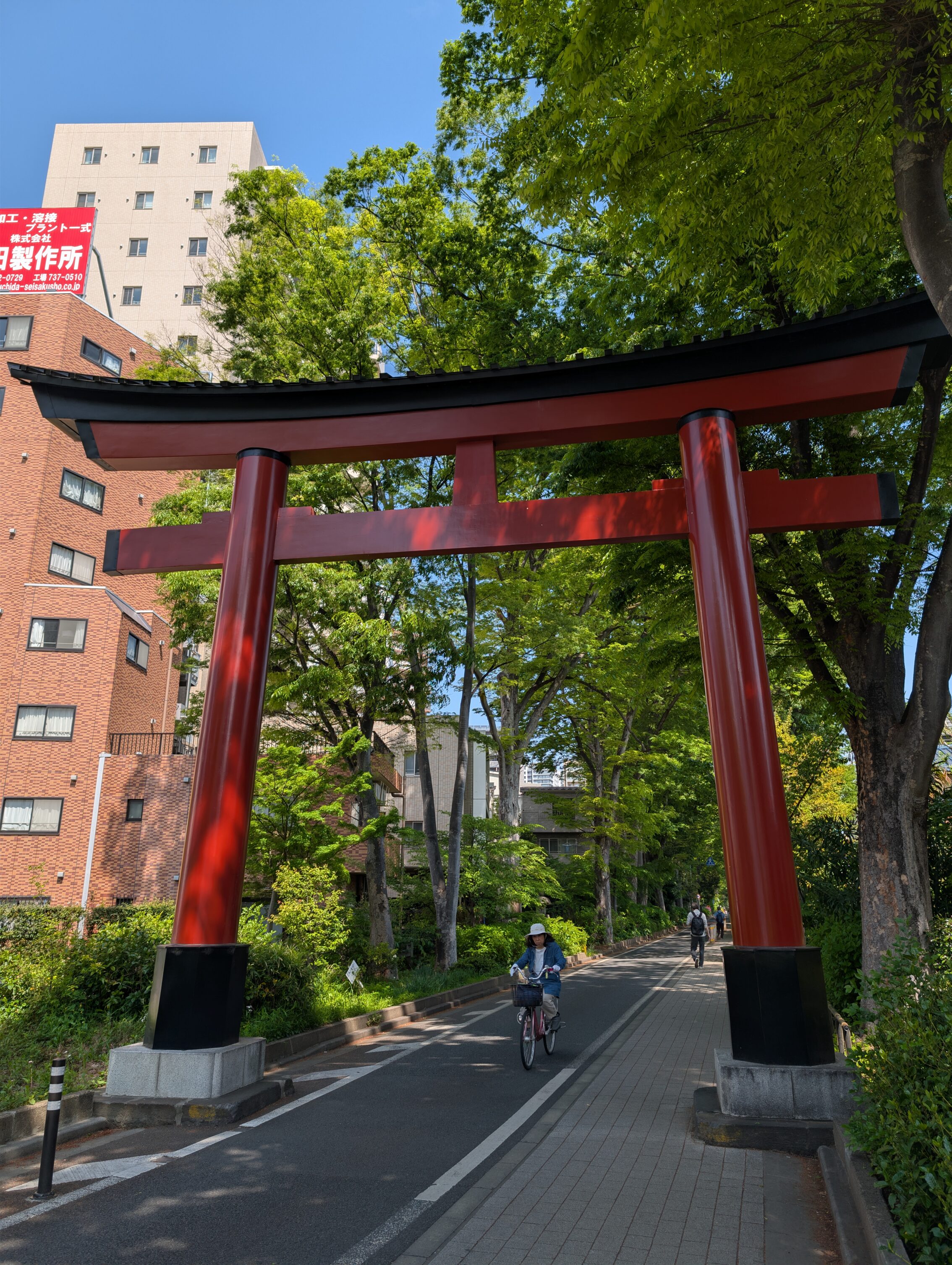 A large torii amidst enticing greenery.