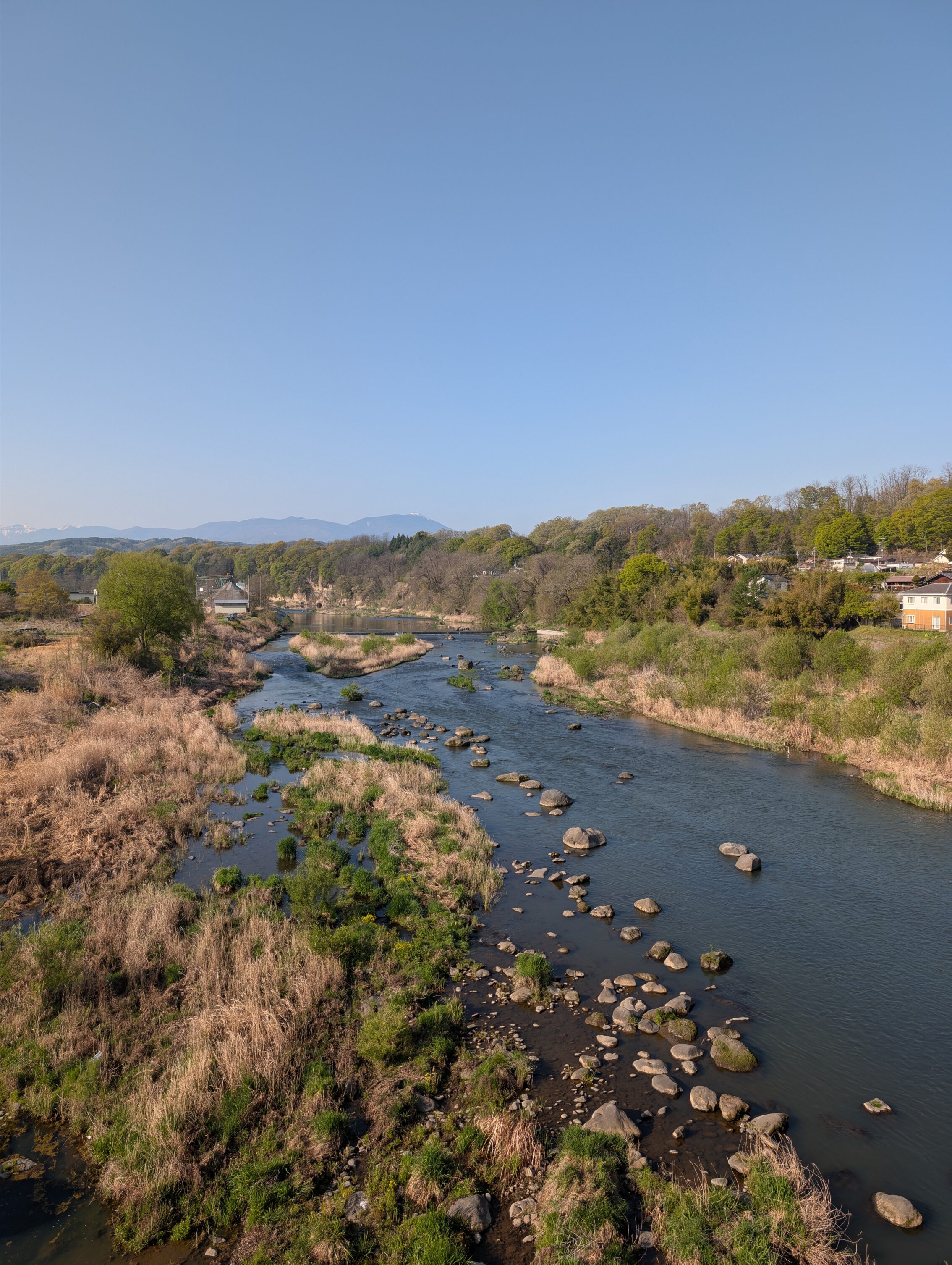 A river as seen from a bridge.