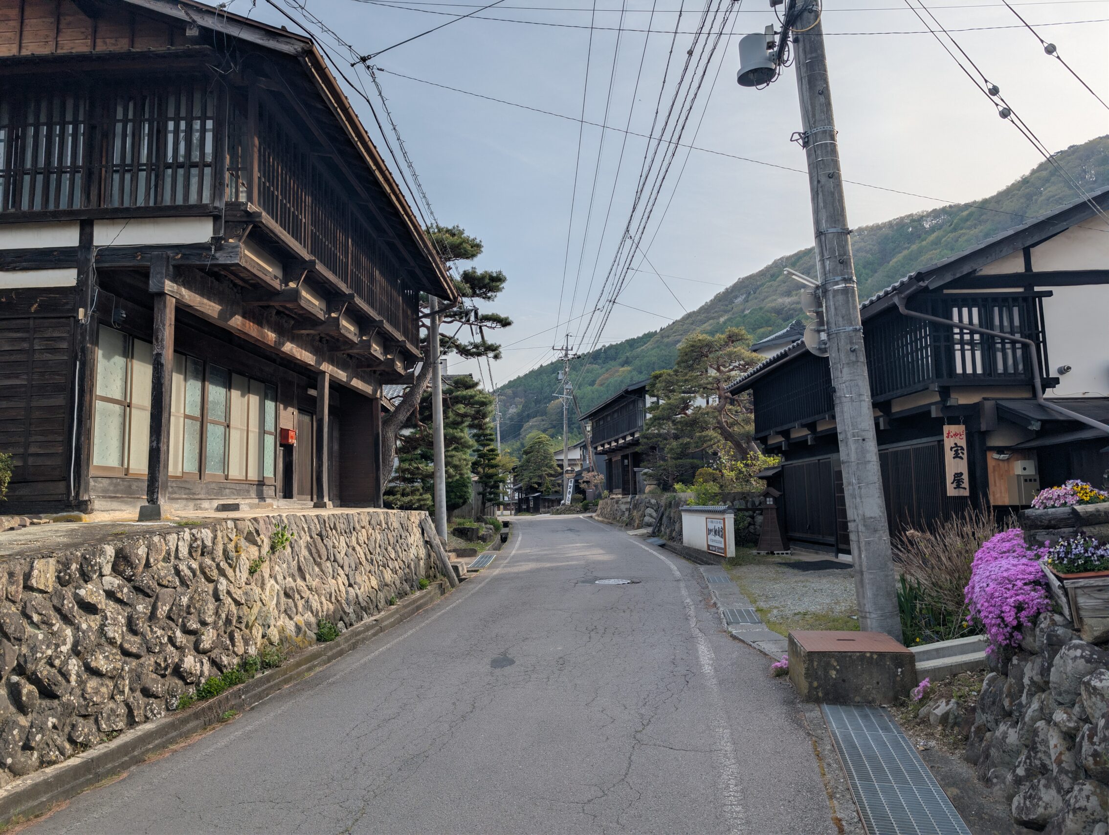 A street with old houses on both sides.