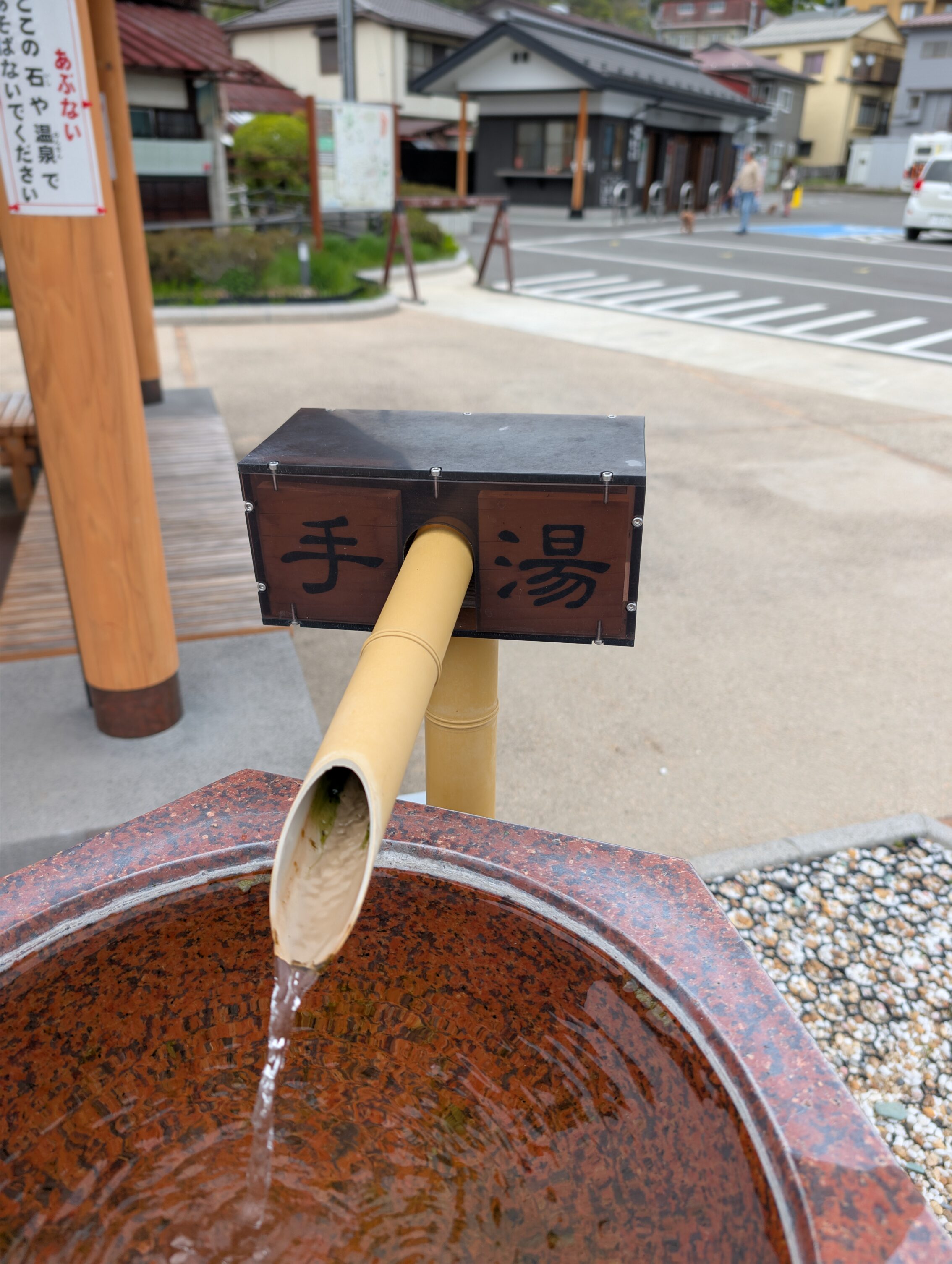 A pipe with water flowing out of it.