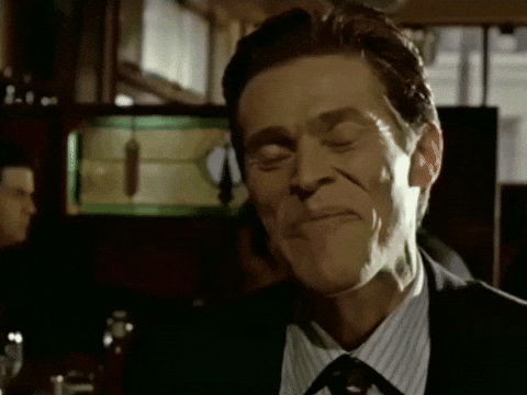 A gif of Willem Dafoe from American Psycho, touching his head as if what was just said was obvious.