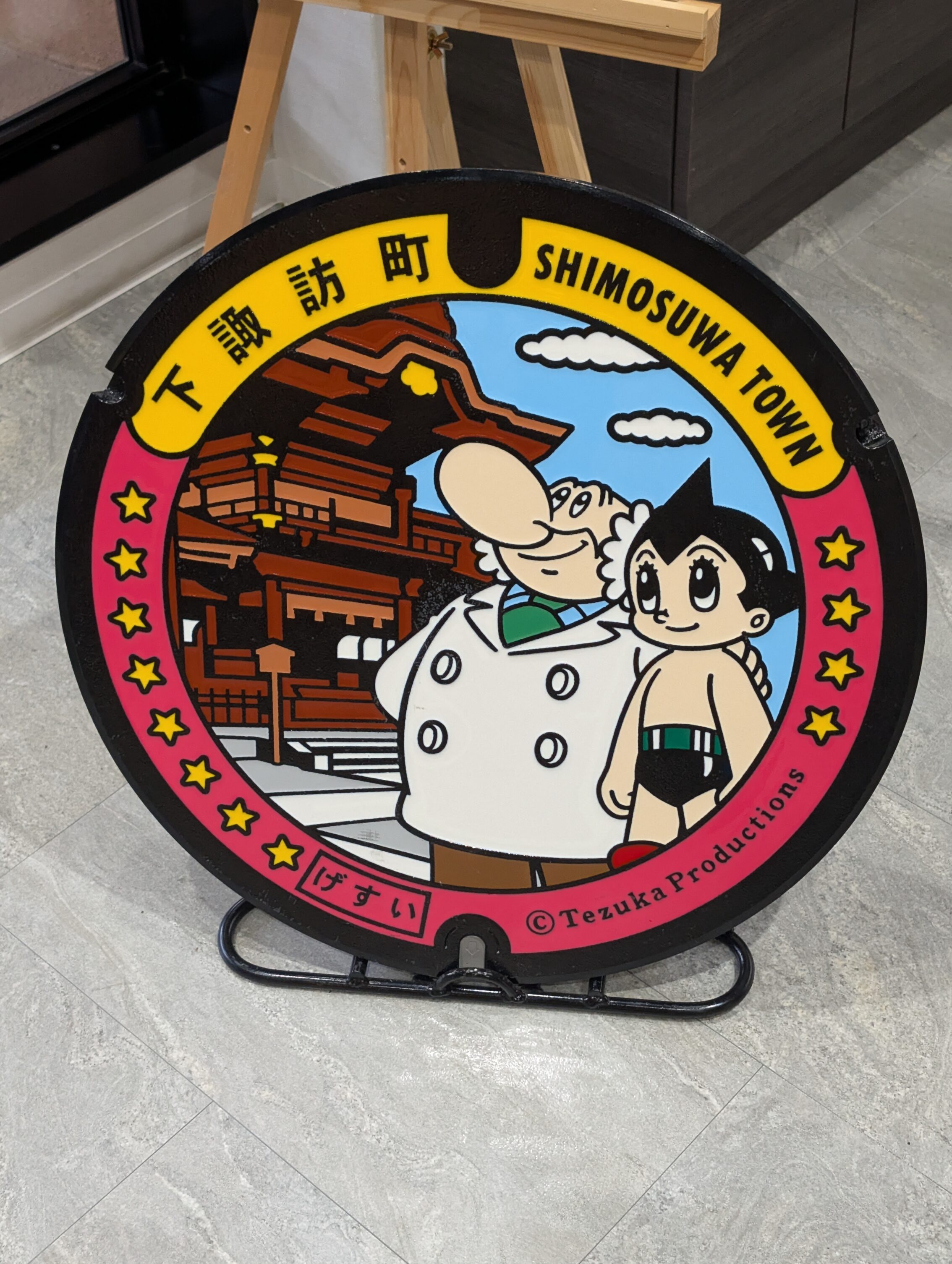 Manhole cover featuring Astro boy.