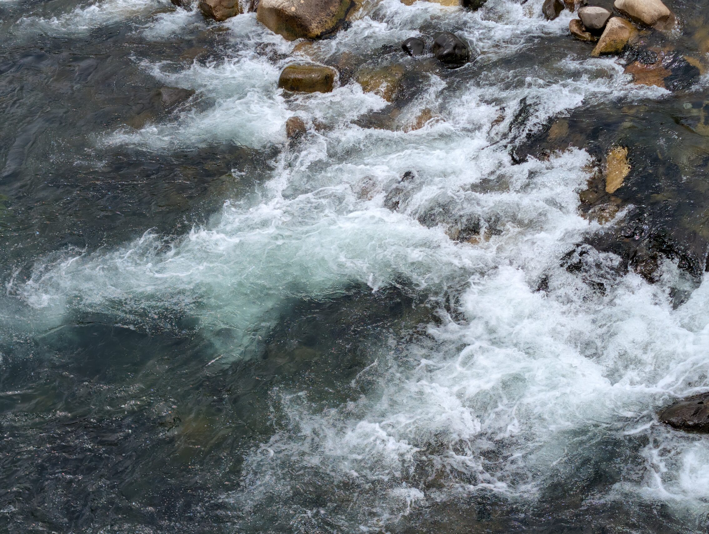 Green clear water churning.