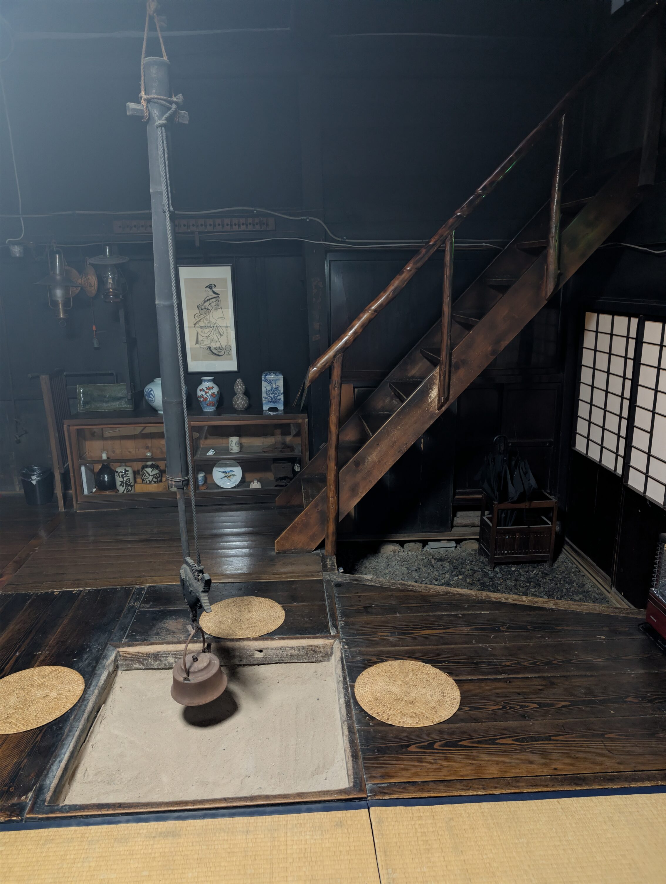 The inside of an Edo period house, with a fire pit.