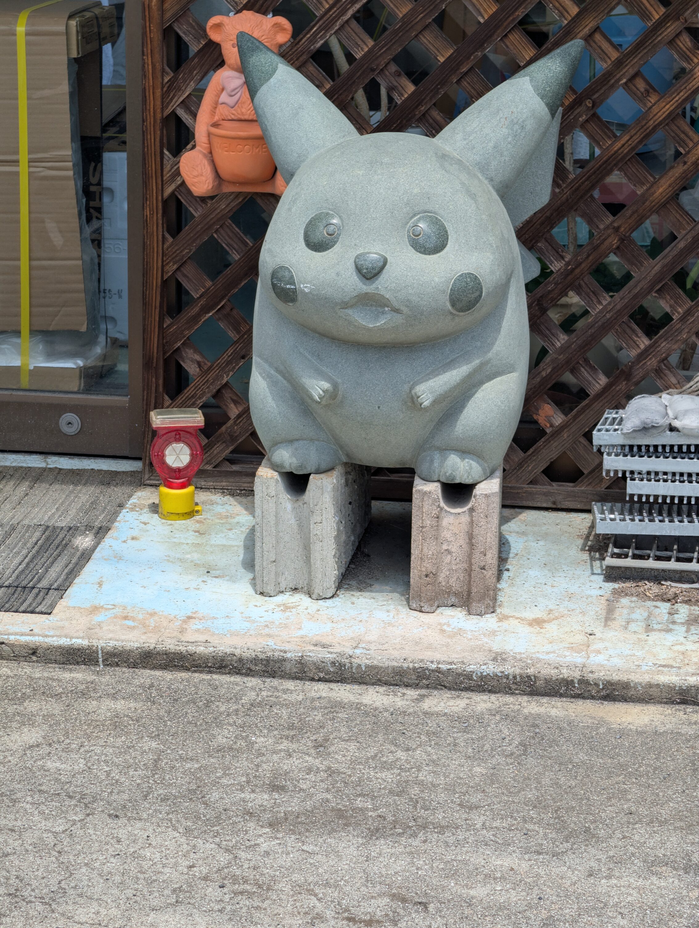 A stone statue depicting Pikachu.