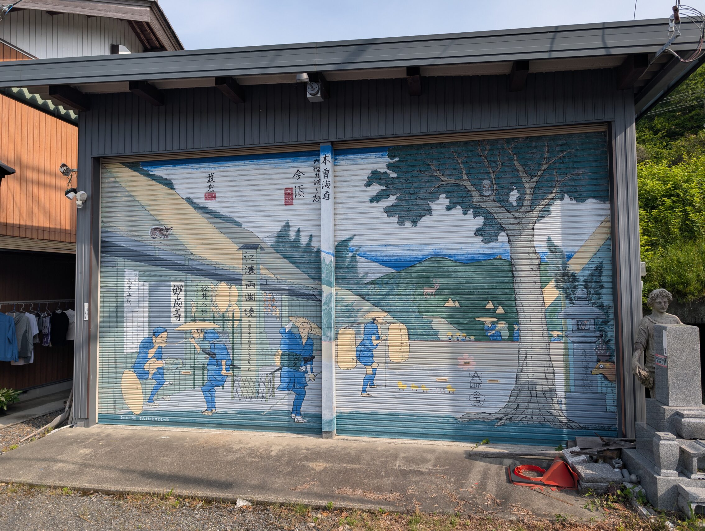 A garage door with a rendition of a woodblock print.