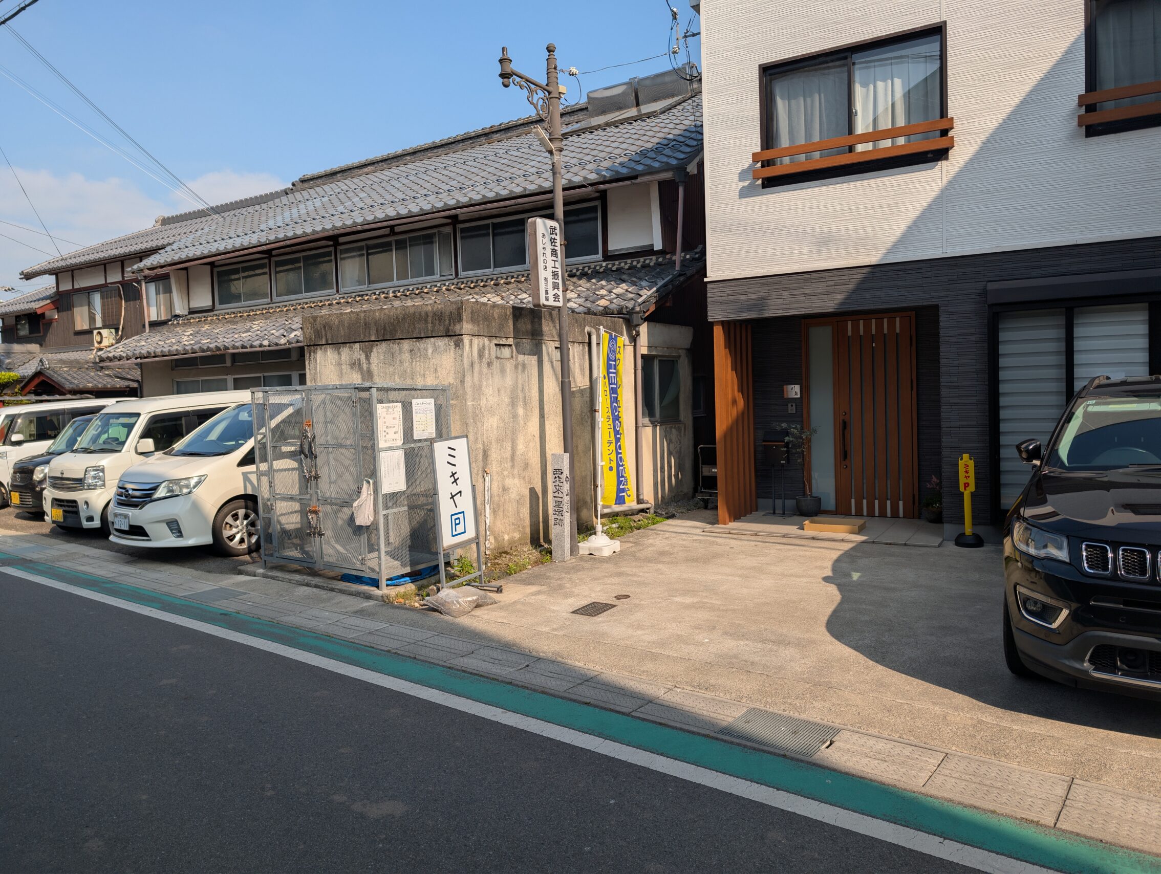 A small parking space in front of a house.