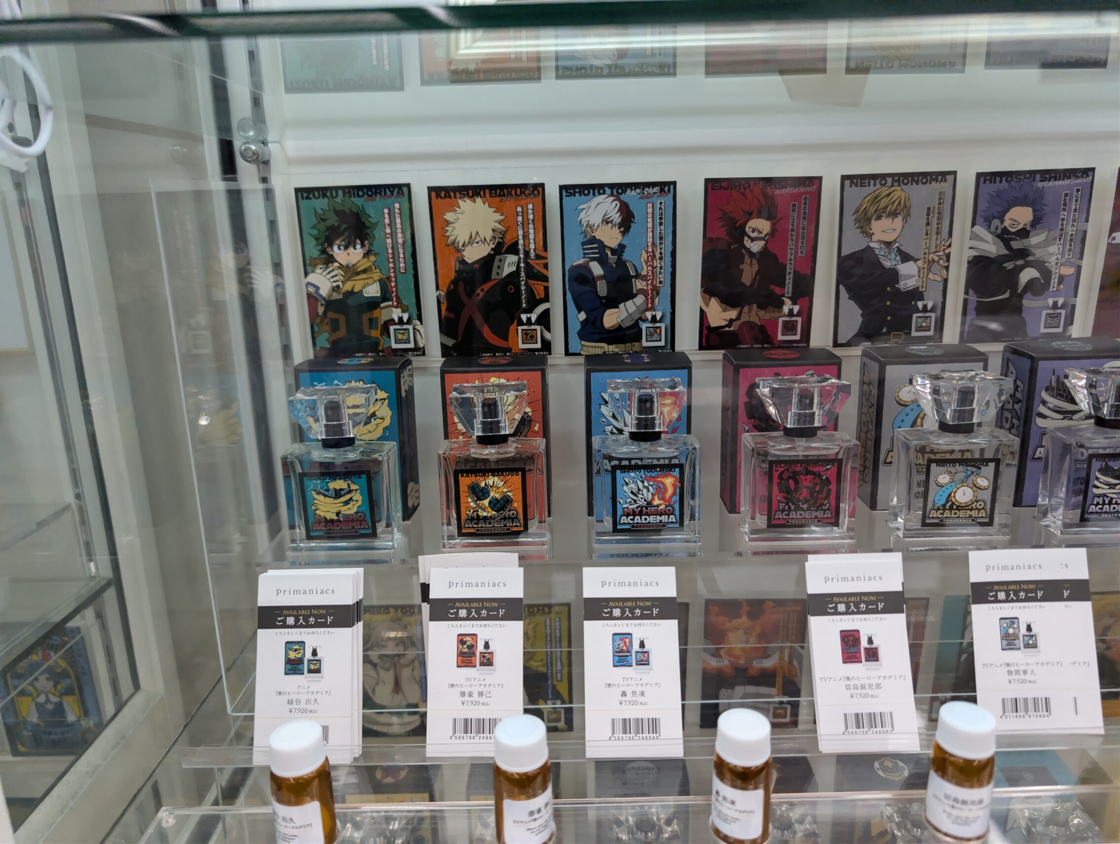 A glass shelf of perfumes. 